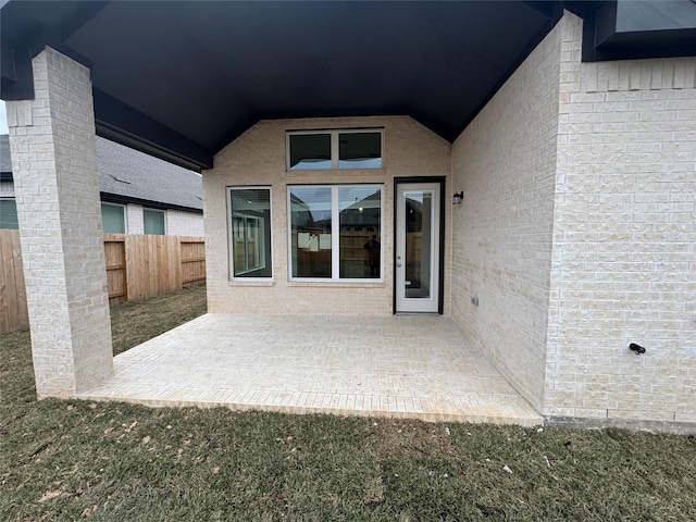 property entrance featuring a patio area