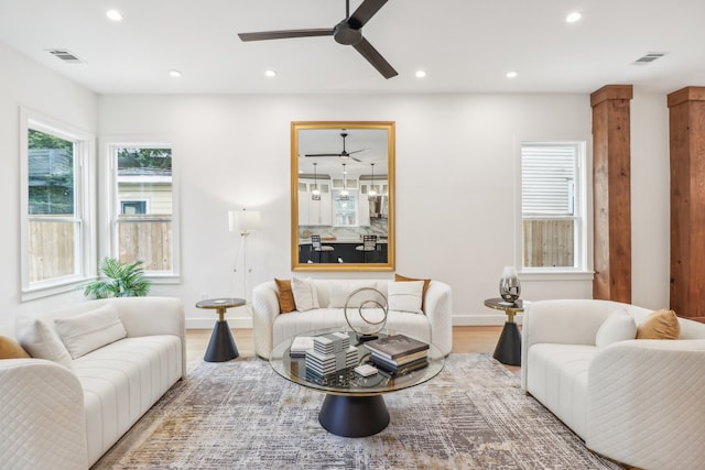 living room with ceiling fan and hardwood / wood-style floors