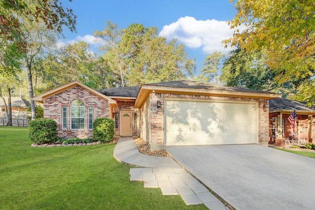 view of front of home with a front yard and a garage