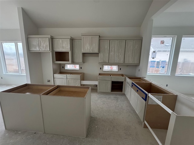 kitchen featuring a center island and a healthy amount of sunlight