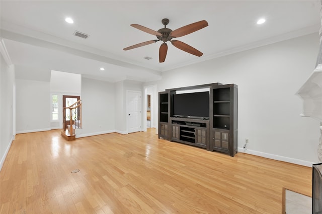 unfurnished living room featuring crown molding, ceiling fan, and light wood-type flooring