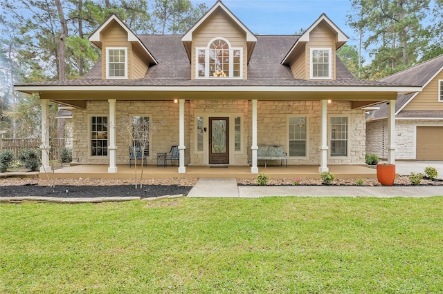 view of front of house featuring covered porch and a front yard