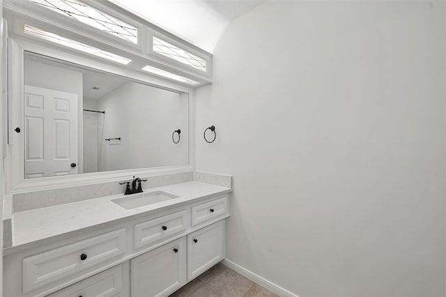 bathroom with tile patterned flooring and vanity