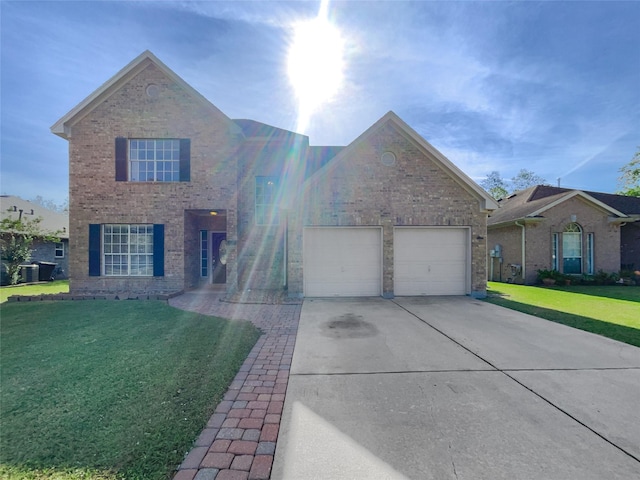 view of front of property with a front lawn and a garage