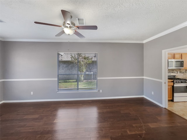 unfurnished room with a textured ceiling, dark hardwood / wood-style flooring, ceiling fan, and ornamental molding