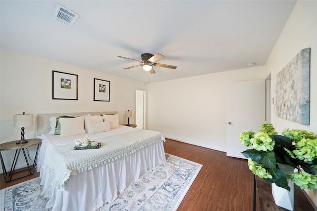 bedroom featuring ceiling fan and dark wood-type flooring