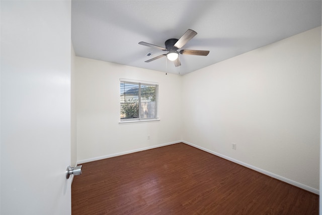 spare room with ceiling fan and dark hardwood / wood-style floors