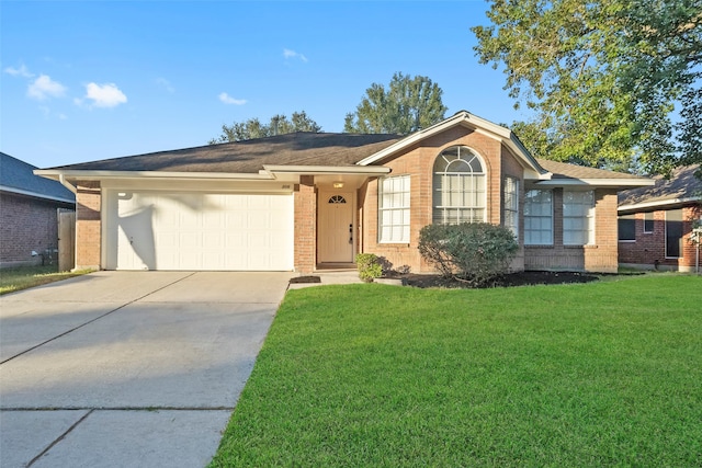 single story home with a garage and a front lawn