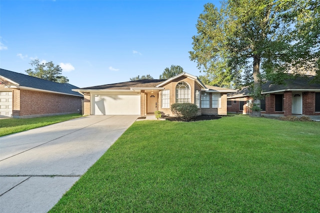 ranch-style home featuring a garage and a front yard