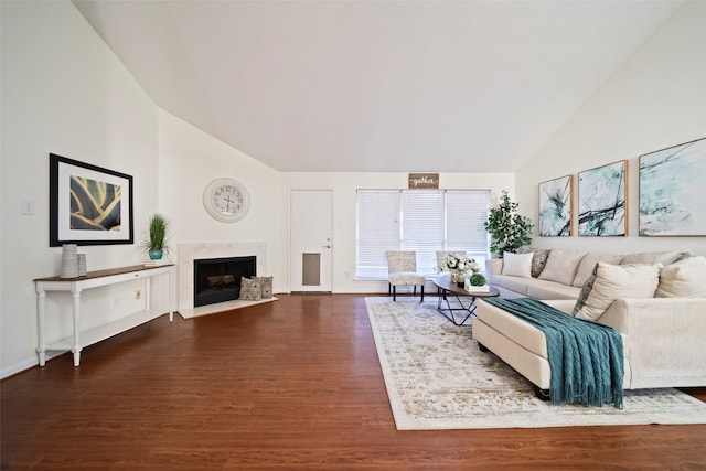 living room with dark hardwood / wood-style floors and vaulted ceiling