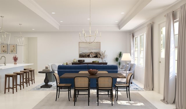 dining room with a tray ceiling, an inviting chandelier, and sink