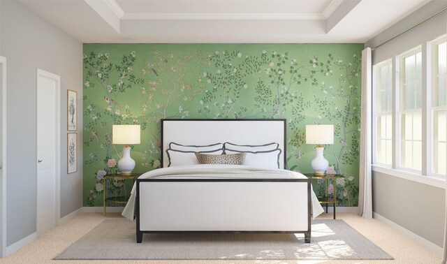 bedroom featuring a tray ceiling, ornamental molding, and light colored carpet