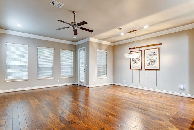 unfurnished room with ceiling fan, wood-type flooring, and crown molding