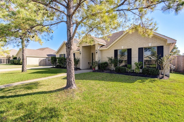 ranch-style home with a front yard