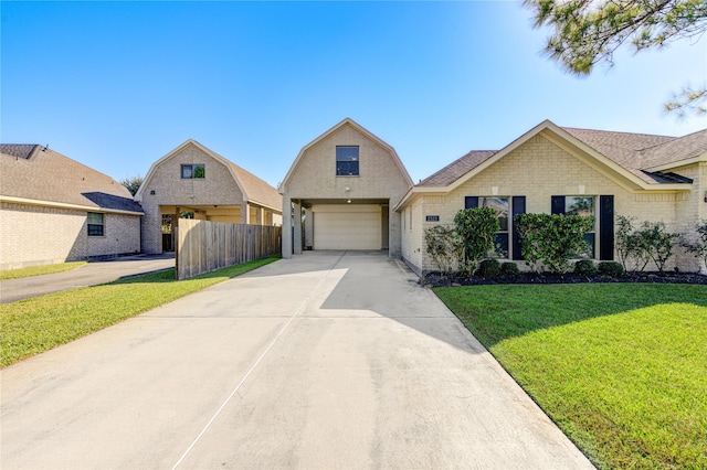 view of front of house with a front yard and a garage