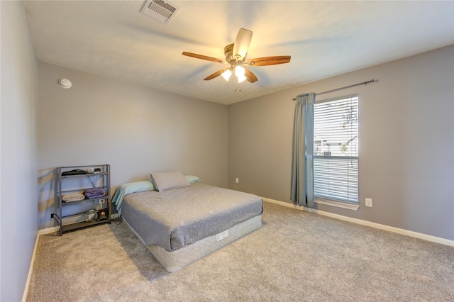 bedroom featuring ceiling fan and light colored carpet