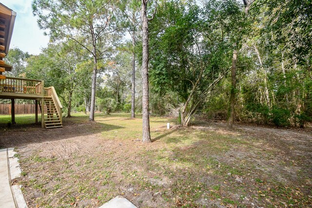 view of yard featuring a wooden deck