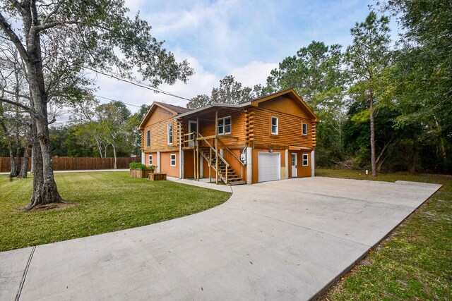 view of home's exterior with a yard and a garage