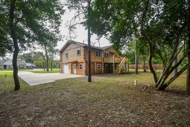 exterior space featuring a deck and a garage