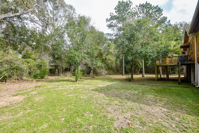 view of yard featuring a wooden deck