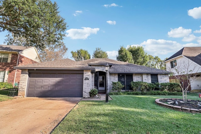 view of front of house with a garage and a front yard