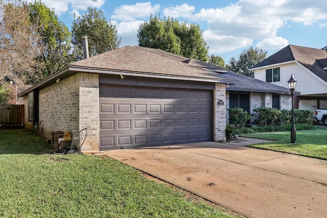 view of front of home featuring a front lawn, an outdoor structure, and a garage