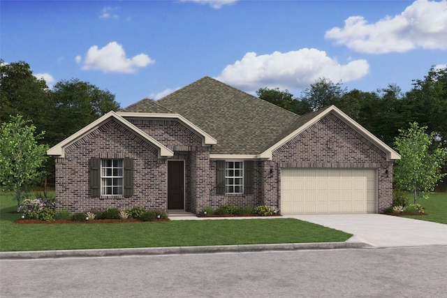 view of front of property featuring a front yard and a garage