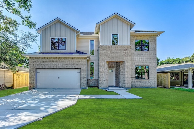 view of front facade featuring a garage and a front lawn