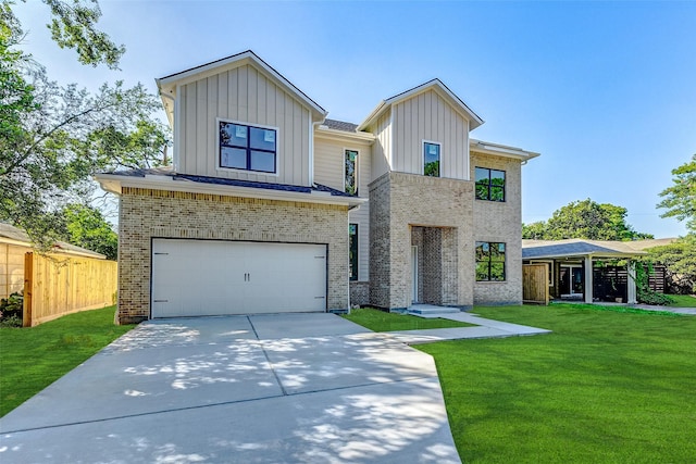 view of front of property with a garage and a front lawn