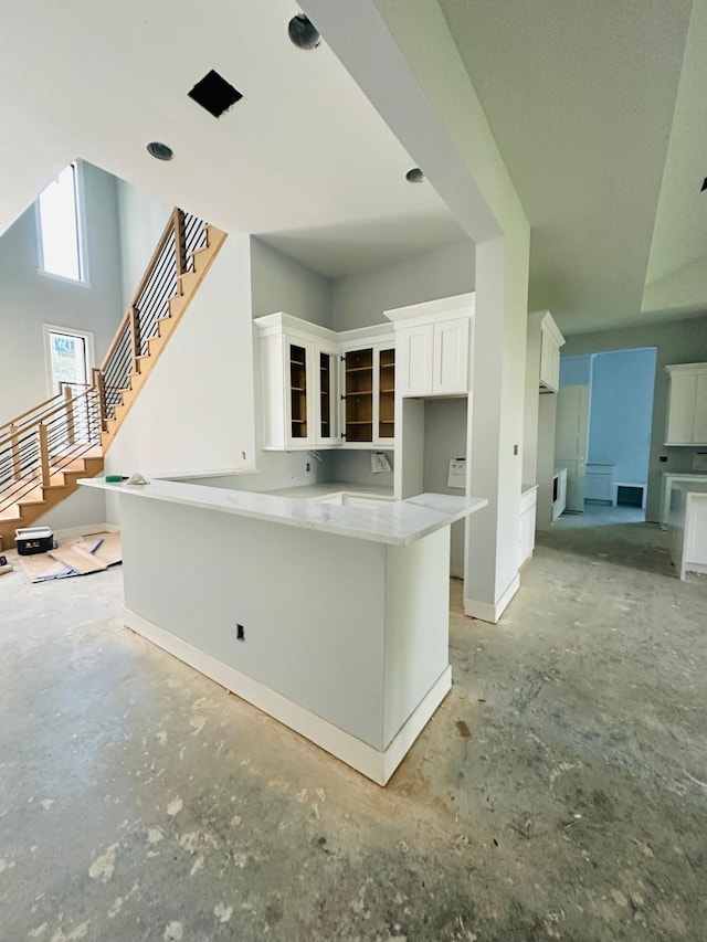 kitchen featuring white cabinetry and kitchen peninsula