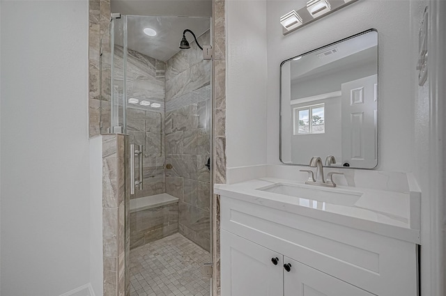 bathroom with vanity and walk in shower