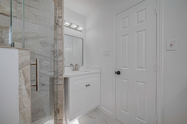 bathroom with vanity and a shower with shower door