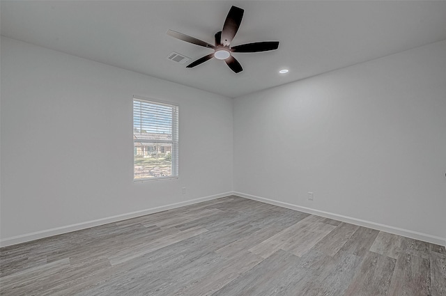 unfurnished room featuring light hardwood / wood-style floors and ceiling fan