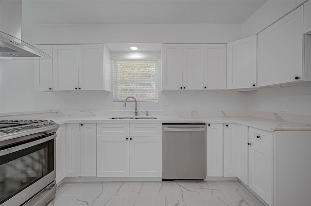 kitchen featuring white cabinetry, ventilation hood, sink, and appliances with stainless steel finishes