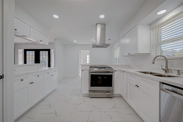 kitchen featuring sink, white cabinetry, stainless steel appliances, and extractor fan