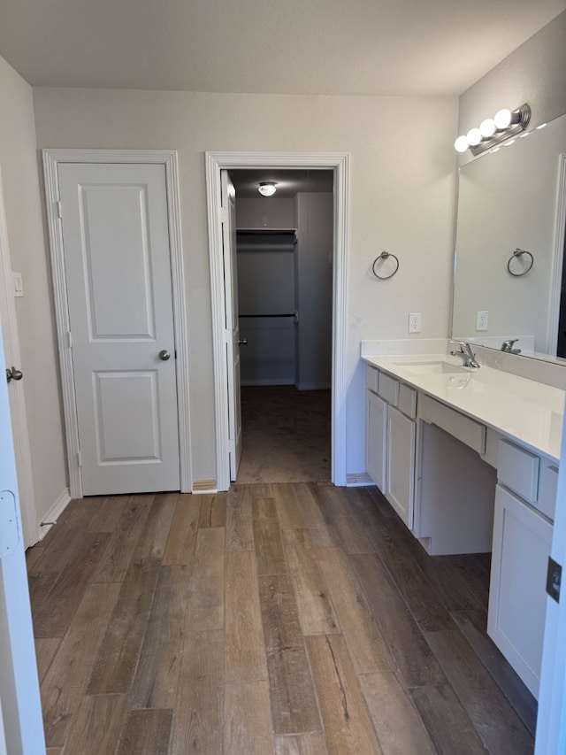 bathroom with hardwood / wood-style floors and vanity