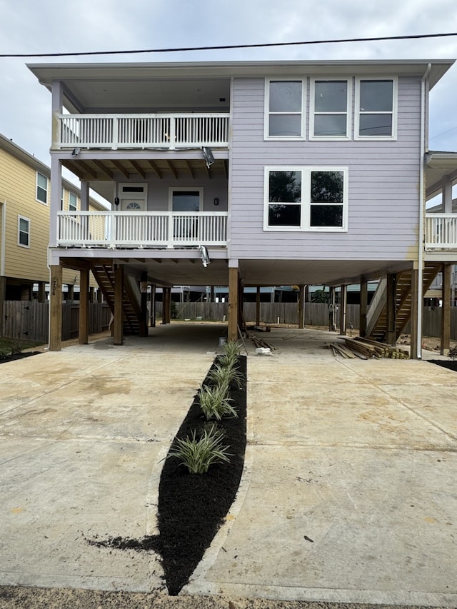 back of property with a carport