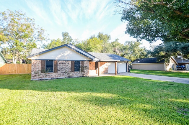 ranch-style home featuring a front lawn and a garage