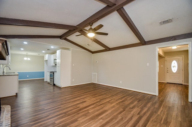 unfurnished living room featuring vaulted ceiling with beams, ceiling fan, sink, and dark wood-type flooring