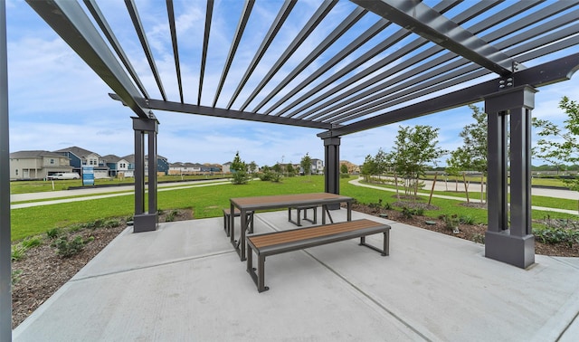 view of property's community with a lawn, a pergola, and a patio