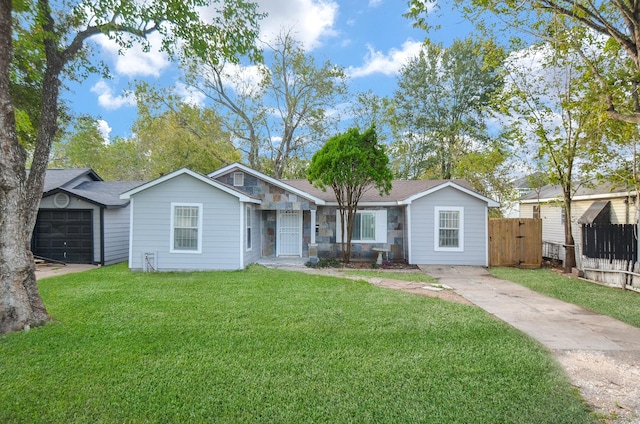 single story home with a front yard and a garage