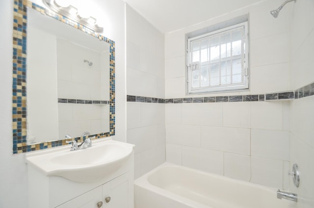 bathroom featuring vanity and tiled shower / bath combo