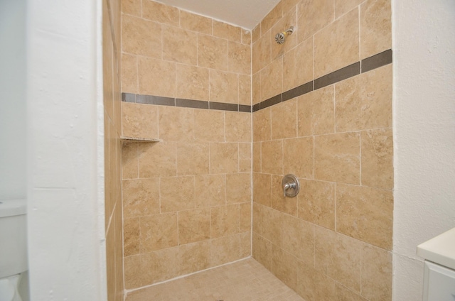 bathroom with a tile shower