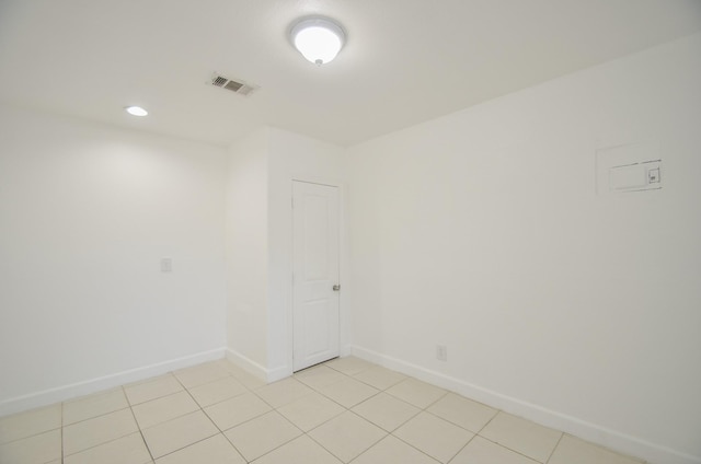 spare room with light tile patterned floors