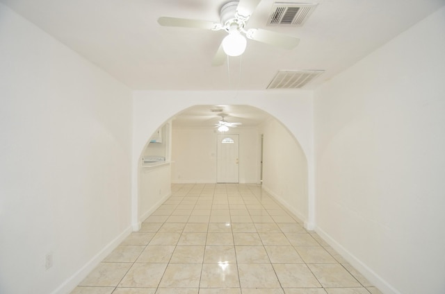 hall featuring light tile patterned floors