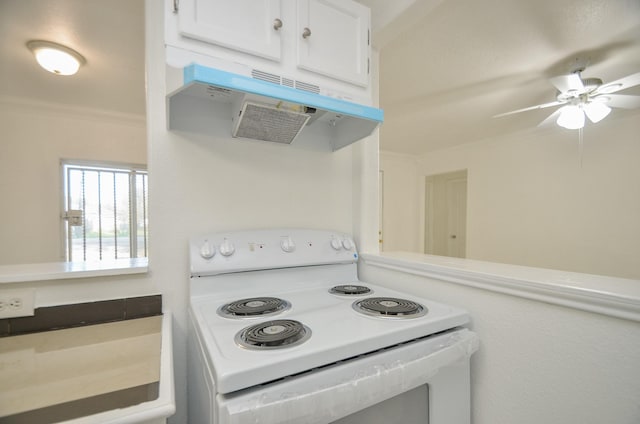 kitchen featuring ceiling fan, white cabinets, white electric range oven, and ornamental molding