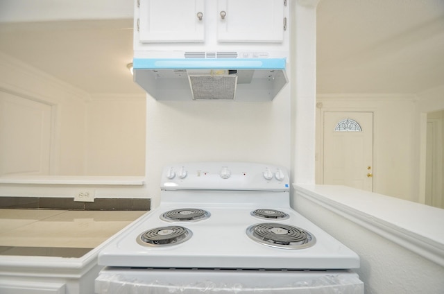 kitchen featuring white cabinets, white electric range, and exhaust hood