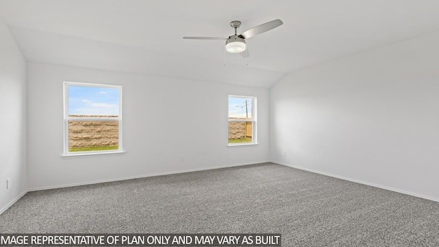 carpeted spare room with vaulted ceiling, a wealth of natural light, and ceiling fan