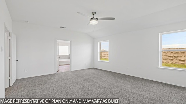 empty room with ceiling fan, carpet, and vaulted ceiling