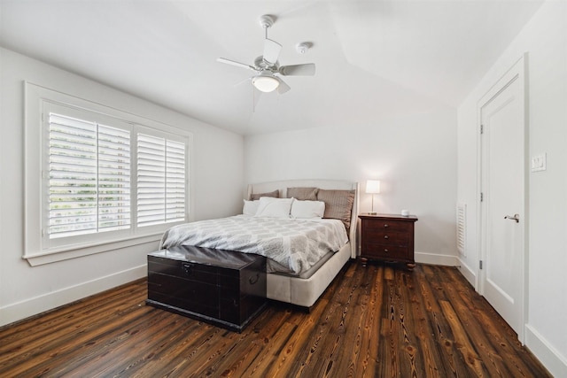 bedroom featuring dark hardwood / wood-style flooring, ceiling fan, and lofted ceiling